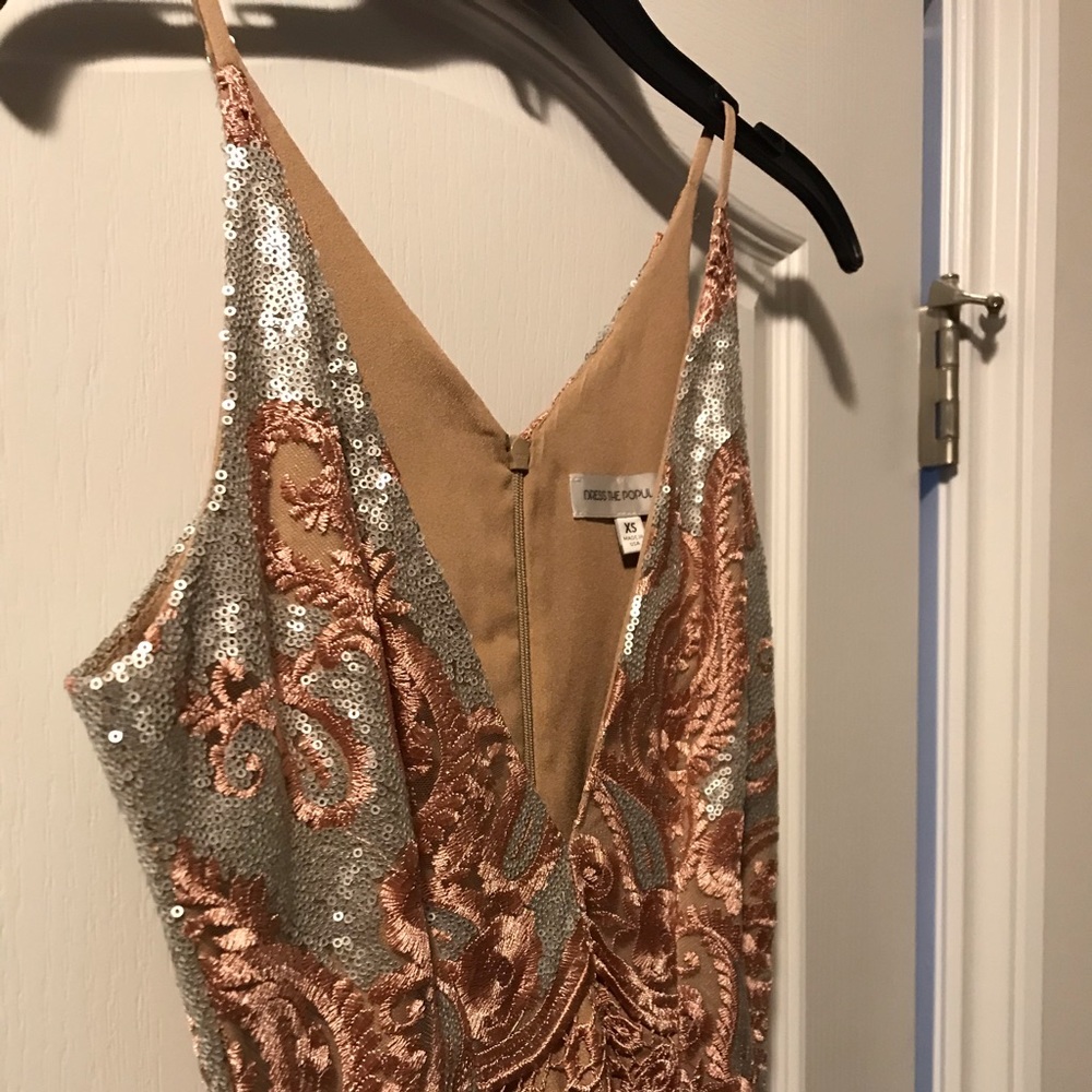 Midi length sequin and lace trim dress.
